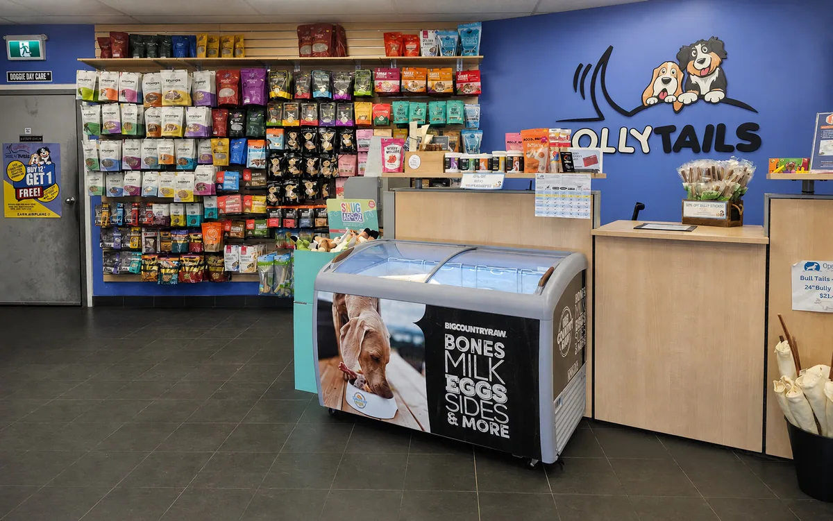 The Jollytails pet store interior with the store logo and a wide selection of treats and pet products
