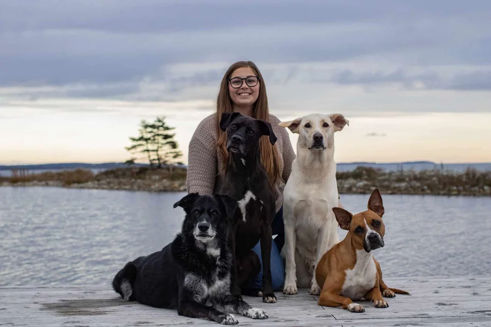 Katie with four dogs outdoors