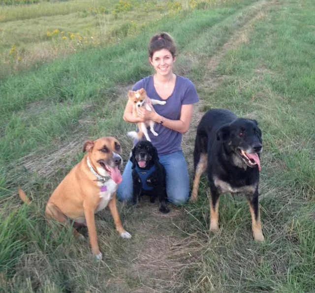 Nicole, a Jollytails groomer, with a dog